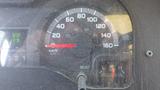 Speedometer and fuel gauge of a 2011 Ford Econoline showing various readings and markings on the dashboard