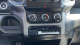 Interior dashboard controls of a 2019 RAM 3500 including climate control knobs and auxiliary switches