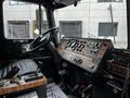The interior dashboard of a 1991 Sutphen Deluge featuring a steering wheel various controls gauges and switches