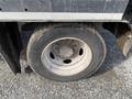 2009 Dodge Ram 5500 truck tire showing a chrome rim and tread detail with rugged texture