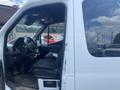 2022 Mercedes-Benz Sprinter with an open driver's side door showing the steering wheel and seat interior