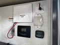 Control panel of a 2022 Heartland Torque featuring an inverter prep switch a solar charge controller and a battery disconnect switch