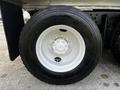 A white wheel with a five-bolt pattern and a black tire labeled Michelin XDE M/S, featuring a tread designed for heavy-duty use on a 2017 International WorkStar 7600