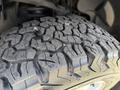 Close-up of a rugged tire tread on a 2018 Ford F-150 showcasing deep grooves and pronounced patterns for enhanced traction
