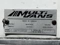A metal nameplate labeled 'MULTI VANS' with details about manufacturing location and specifications attached to a surface
