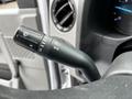 Close-up of a turn signal and wiper control stalk in a 2021 Ford E-450 vehicle dashboard