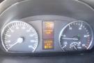 Dashboard of a 2012 Mercedes-Benz Sprinter displaying speedometer fuel gauge temperature and warning for low beam headlight