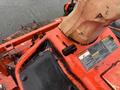 A 2010 Kubota F3680 lawn mower with a bright orange body featuring various control knobs and warning labels on the operator's panel
