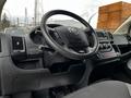 Interior view of a 2021 RAM Promaster with a steering wheel dashboard and controls visible