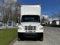 A white 2016 Freightliner M2 106 truck facing forward with a large enclosed cargo box and a black front bumper