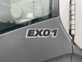 A close-up view of a Hitachi ZX200LC excavator's side panel featuring the logo EX01