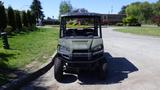 A 2016 Polaris Ranger 570 Crew in a green color with a two-row seating layout and rugged tires designed for all-terrain driving