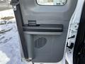 The inside of a door panel from a 2011 Ford F-450 SD featuring a handle a storage compartment and an air vent