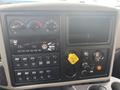 Dashboard of a 2016 International 7400 featuring various gauges buttons and a radio panel