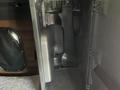 Interior storage compartment of a 2022 Freightliner Cascadia with a sleek design and gray plastic material