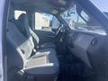 Interior of a 2014 Ford F-250 SD showing two front seats and the dashboard with controls and steering wheel