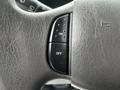 Close-up of the steering wheel control panel of a 2008 Ford Econoline featuring buttons labeled ON and OFF