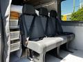 Interior of a 2017 Mercedes-Benz Sprinter showing three black fabric seats with seatbelts