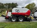 A 2020 Pottinger Impress 155 VC Pro baler with a red and white exterior and large wheels designed for agricultural use