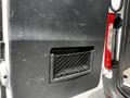 A 2019 Mercedes-Benz Sprinter door with a black interior panel featuring a mesh pocket for storage