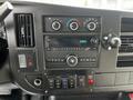 Dashboard of a 2019 Chevrolet Express showing climate controls radio and various buttons and switches