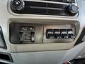 Interior control panel of a 2016 Ford F-550 featuring switches for auxiliary functions and climate control knobs