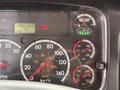 Dashboard of a 2014 Freightliner B2 displaying gauges for speed, RPM, fuel, oil, and brake systems along with a digital odometer reading