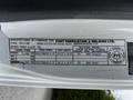 Label from a 2014 Hino 195 displaying manufacturing details including GVWR, tire specifications, and company information
