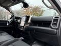 Interior view of a 2024 RAM 5500 showcasing a modern dashboard with a large touchscreen display and leather seats