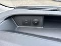 A close-up view of the dashboard of a 2023 Ford Transit showing a USB port and a 12V power outlet
