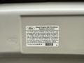 A label on a 2009 Ford Econoline detailing the diesel engine idle shutdown system information