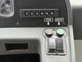 Control panel of a 2018 Grande West Vicinity featuring buttons labeled for stow and deploy functions along with gear shift indicators 123 D N R