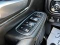 Close-up view of the power window controls on the driver's side door of a 2019 RAM 1500 including buttons for window operation and door locking