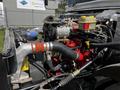 2022 Blue Bird BB Conventional bus engine compartment with visible components like hoses fan belt and coolant reservoir