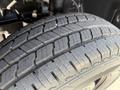 Close-up of a tire with deep tread patterns showing wear on a 2019 Mercedes-Benz Sprinter