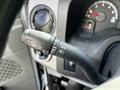 A close-up of the control stalk in a 2019 Ford Econoline showing the turn signal and windshield wiper controls