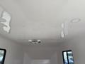 Interior view of a 2025 Shuttle Office featuring a smooth white ceiling with recessed lights and an air conditioning unit in the center