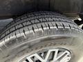 A close-up of a tire from a 2016 Mercedes-Benz Sprinter showcasing the tread pattern and the alloy wheel design