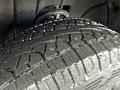 Close-up view of a tire on a 2015 GMC Sierra 1500 showing detailed tread patterns and tread depth