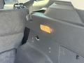 Interior view of a 2014 Ford Escape showing the rear cargo area with a storage compartment and an illuminated warning light