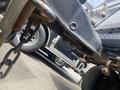 A 2020 Stealth Enterprises Trailer with a focus on its metallic frame showing some rust and attached chain components