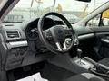 Interior view of a 2016 Subaru Crosstrek showing the steering wheel dashboard and gear shift