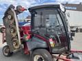 A 2014 Toro Groundmaster 5910 turf maintenance machine with a glass cabin and multiple rotary cutting decks attached to the side