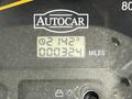 A digital display showing the mileage of a 2012 Autocar Xpert with readings of 2142 miles and 00324 on the screen