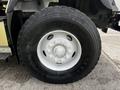 Close-up of a Michelin tire mounted on a wheel of a 2017 International WorkStar 7600 with a silver rim and prominent tread pattern