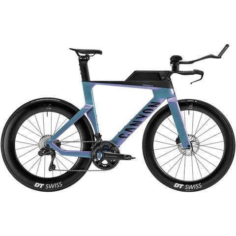 A 2026 Canyon Speedmax CF 8 Di2 road bike featuring a sleek frame with a gradient color scheme and aerodynamic design equipped with DT Swiss wheels and a compact gearing system