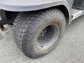 A close-up view of a rugged tire on a 2011 Kubota RTV 1140 CPX showcasing its tread pattern and robust design