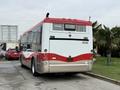A red and white 2016 Grande West Vicinity bus viewed from the rear with the number 2038 displayed on the back