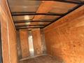 Interior of a 2020 Mirage Enterprises 12 Foot Cargo trailer featuring wooden walls and flooring with metal accents and a curved ceiling