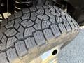 Close-up of a worn tire tread on a 2012 Ford Econoline E-450 showing distinct patterns and grooves